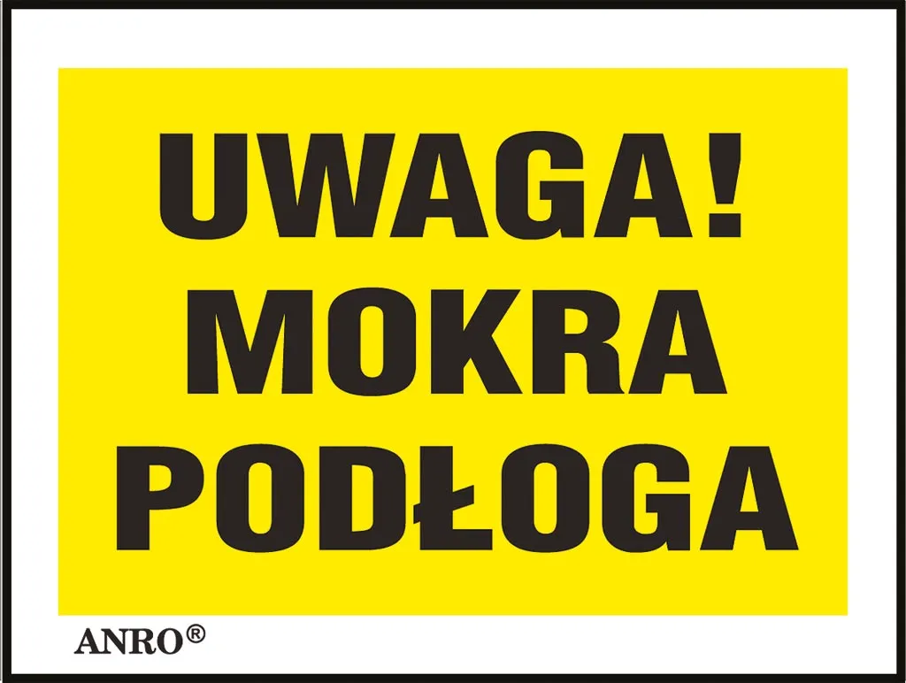 Żółta naklejka z czarnym napisem „UWAGA! MOKRA PODŁOGA” w ramce.