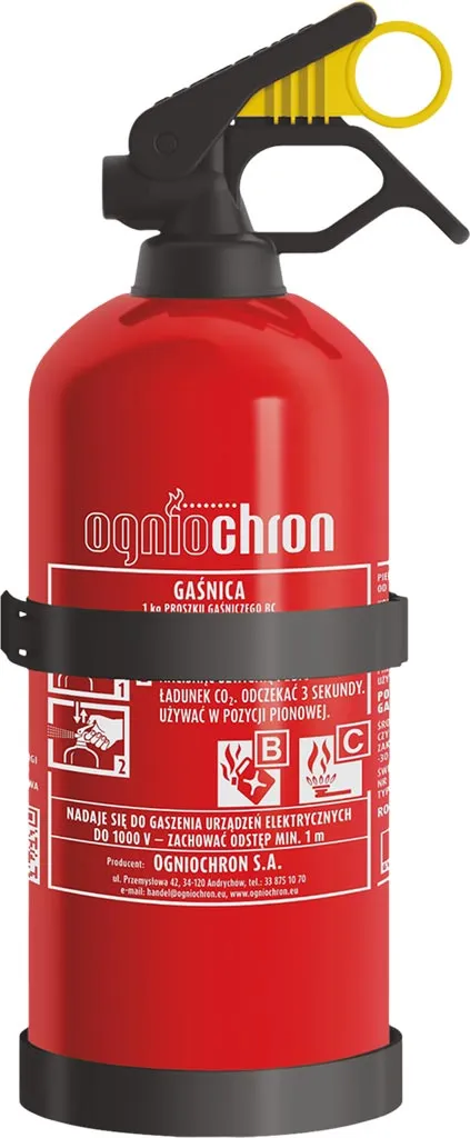 Gaśnica proszkowa 1 kg, czerwona, z żółtym uchwytem. Na etykiecie znajduje się instrukcja obsługi i informacje o klasach pożaru: A, B, C.