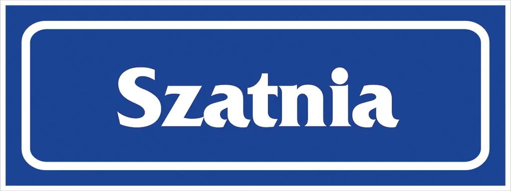 Prostokątny niebieski znak z białym napisem „Szatnia”. Znak jest otoczony białą ramką.