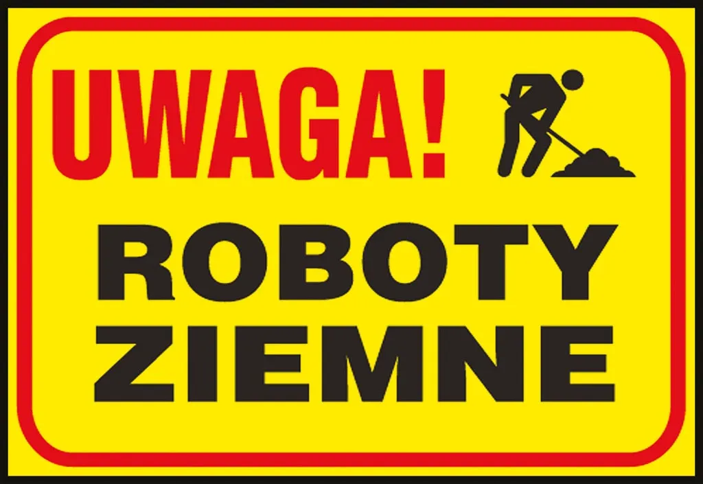 Tablica z żółtym tłem, na której znajduje się czarny napis „UWAGA! ROBOTY ZIEMNE” oraz ikona osoby pracującej z łopatą.