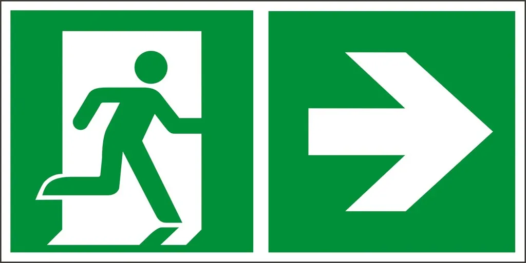 Znak bezpieczeństwa przedstawiający zielony symbol osoby wychodzącej przez drzwi oraz strzałkę wskazującą kierunek na prawo, używany do oznaczania wyjścia ewakuacyjnego.
