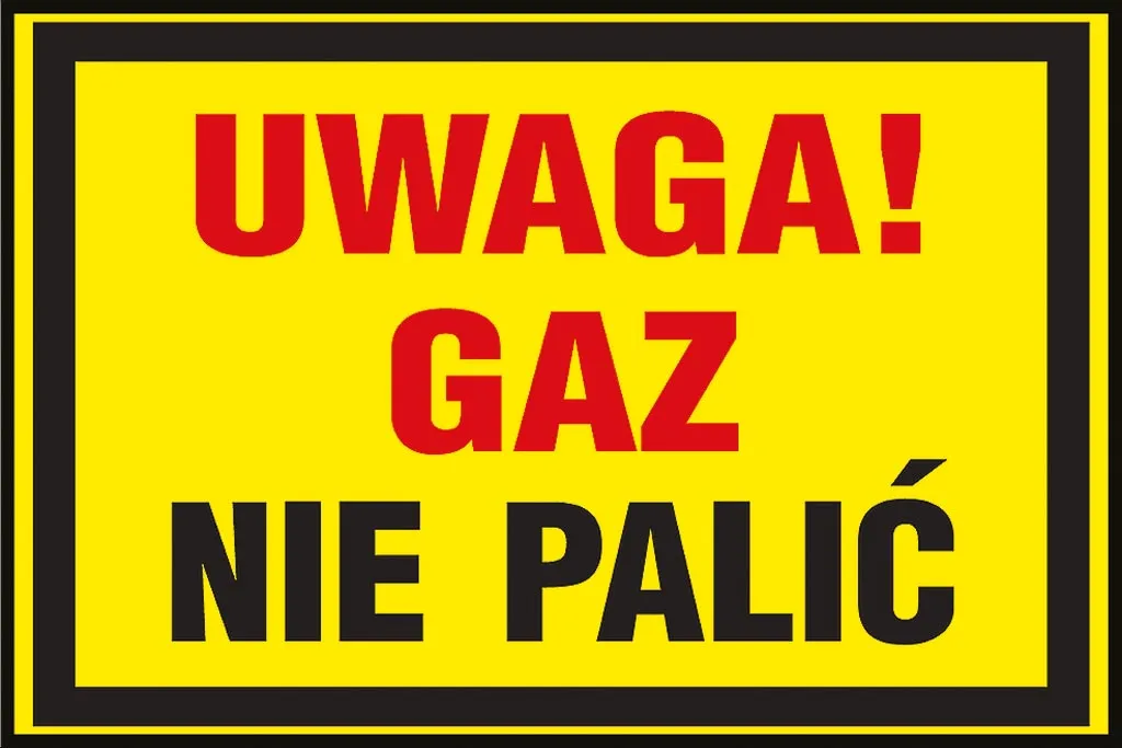 Znak ostrzegawczy w kolorze żółtym z napisem