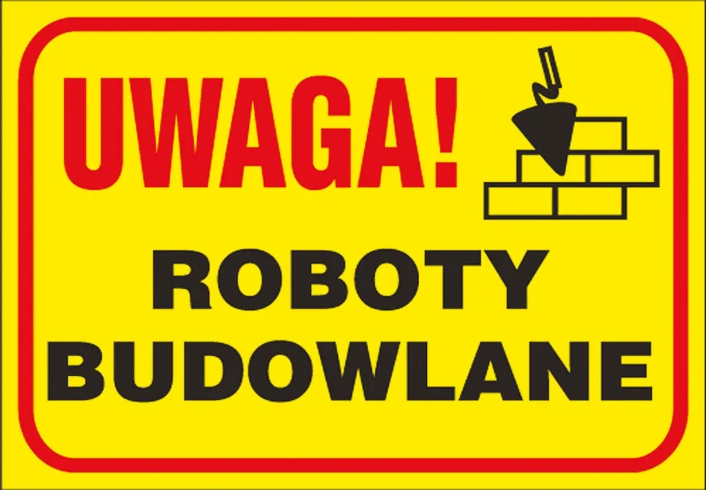 Żółta tablica z napisem „UWAGA! ROBOTY BUDOWLANE