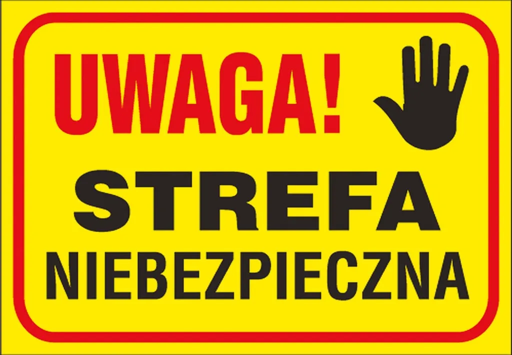 Żółta tablica ostrzegawcza z czarnym i białym napisem „UWAGA! STREFA NIEBEZPIECZNA” oraz białą grafiką otwartej dłoni.