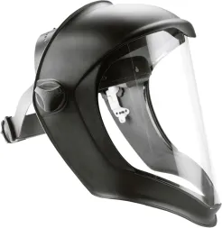 Osłona twarzy BIONIC z przezroczystym, zakrzywionym wizjerem oraz czarną, matową oprawką. Posiada regulowany pasek do mocowania na głowie i ochraniacz podbródka.