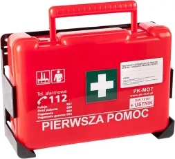 Czerwona apteczka pierwszej pomocy z białym krzyżem, zawiera numery alarmowe. Wyposażenie zakładowe.