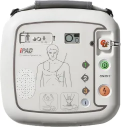 Defibrylator AED iPAD SP1 wyposażony w przyciski funkcyjne, wskaźniki stanu i ilustracyjne instrukcje użycia. Posiada również wbudowany głośnik i uchwyt do przenoszenia.