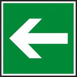 Znak ewakuacyjny na zielonym tle, z białą strzałką skierowaną w lewo, wskazujący kierunek drogi ewakuacyjnej.