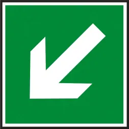 Znak ewakuacyjny na zielonym tle z białą strzałką wskazującą kierunek w lewo dolny.